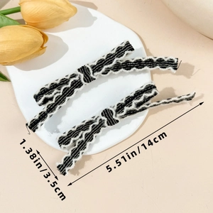 Detailed size view of striped plush bow hair clip measuring 14cm by 3.5cm for women