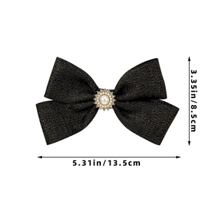 Detail of elegant black fabric bow hair clip with pearl and rhinestone center size specs