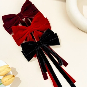 Elegant velvet bow hair clips with long ribbons in red and black colors for women
