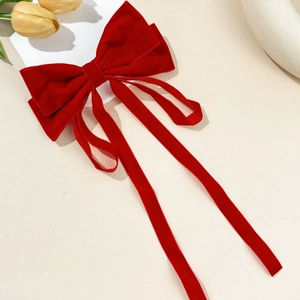 Elegant red velvet bow hair clip with long ribbons and premium vintage aesthetic