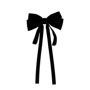 Elegant black velvet bow hair clip with long ribbons for a vintage princess style