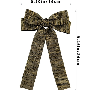 Detail showing oversized striped bow hair clip dimensions 6.30in width by 9.46in length