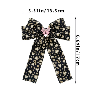 Leopard print bow hair clip with size measurements 13.5cm width and 17cm height
