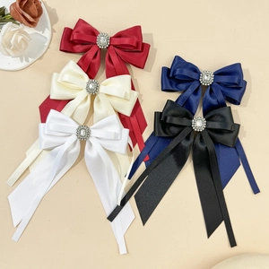 Elegant satin bow hair clips with long streamers and central rhinestone in five colors