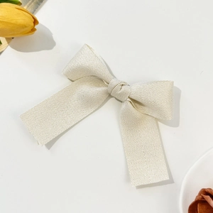 Elegant ivory herringbone bow hair clip for women, sweet minimalist accessory on white