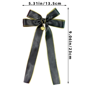Detailed dimensions of black satin hair bow with gold trim and heart bell pendant