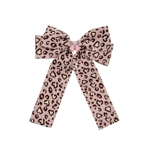 Pink leopard print hair clip with bow design and silver glitter resin center detail