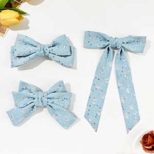 Set di 3 fermagli per capelli con fiocchi in denim azzurro e paillettes argentate