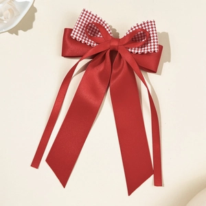 Red bow hair clip with houndstooth pattern and long ribbons for elegant women styling