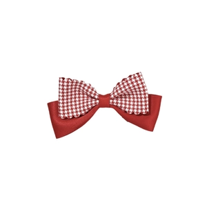Red and white checkered fabric bow hair clip with layered festive ribbon design