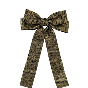 Golden pleated metallic fabric bow hair clip with textured ribbon for women's hairstyle
