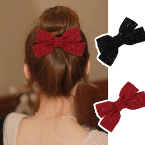 Elegant sequin bow hair clip set in red and black tweed for vintage festive hairstyling