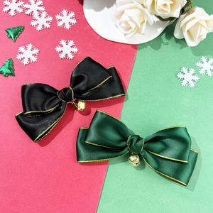 Christmas bow hair clips in black and dark green with gold trim and bells for women