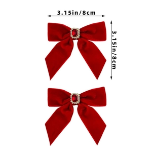 Close-up of two red velvet hair bows with ruby center and rhinestone inlay, 8cm size