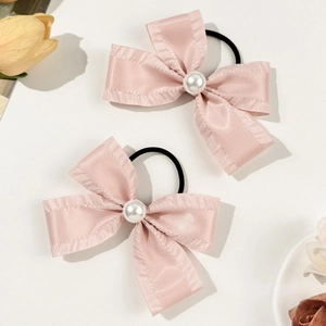 Pink silk bow scrunchies with white pearl center for women hairstyles