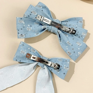 Sparkly denim bow hair clips in light blue with silver sequins and metal alligator base