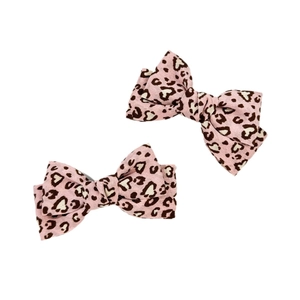 Pink leopard print bow hair clips set with textured fabric for stylish hair styling