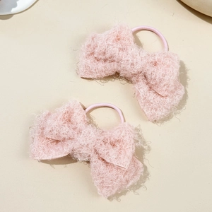 Sweet pink plush bow hair ties for women with soft teddy fleece texture and elastic band