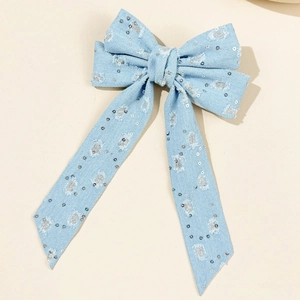 Blue denim bow hair clip with silver sequins and stylish long ribbon streamers