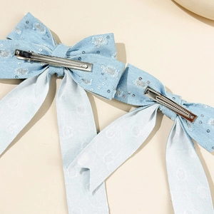 Light blue denim hair bow clip with silver sequins and long ribbons for women