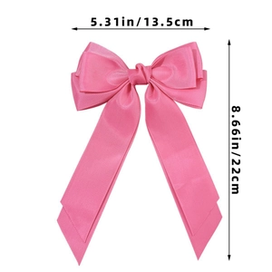 Rosa Schleifen-Haarspange mit Maßen: 13,5 cm Breite und 22 cm Länge im Detail gezeigt