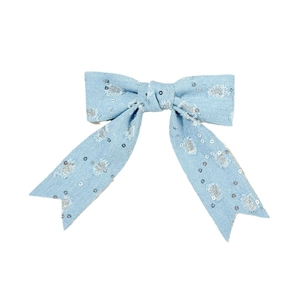 Light blue denim bow hair clip with silver sequins and distressed vintage texture