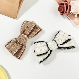 Elegant tweed bow hair clips set with sequins and faux fur trim for autumn and winter
