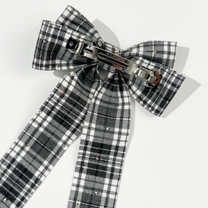 Detail of vintage plaid bow hair clip with rhinestones and metal spring clasp back