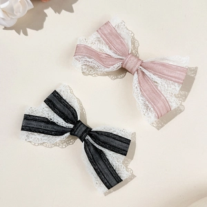 Lace bow hair clips in pink and black ribbons with sweet vintage floral details