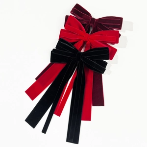 Elegant velvet bow hair clip with long ribbons in burgundy, red, and black colors