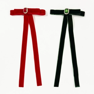 Elegant velvet bow hair clips with ruby and emerald gemstones in red and green colors