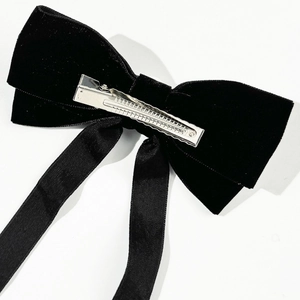 Elegant black velvet bow hair clip with long ribbons and pearl detail for women