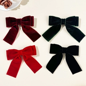 Set of four velvet bow hair clips in burgundy, dark green, red and black colors
