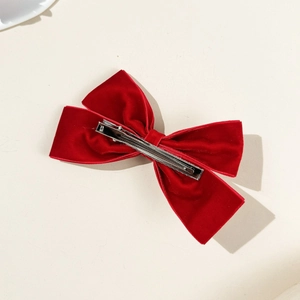 Elegant red velvet bow hair clip with silver metal alligator clamp on back view