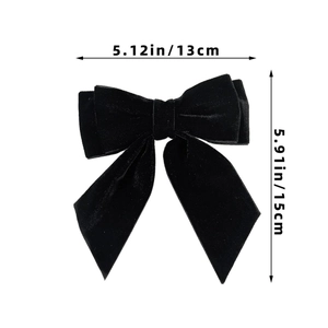 Detail view of black velvet bow hair clip with dimensions 13cm width and 15cm height