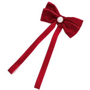 Elegant red velvet bow hair clip with white pearl centerpiece and long flowing ribbons