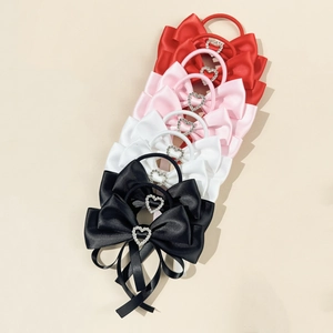 Satin bow hair scrunchies with heart rhinestone accents in red, pink, white and black