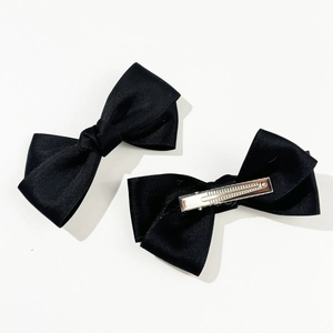 Elegant set of two black satin bow hair clips with silver metal crocodile hair grippers