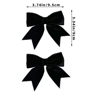 Detail showing two black velvet bow hair clips with specific dimensions 9.5cm and 9cm