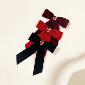 Elegant velvet bow hair clips in red and black with luxury rhinestone and red gemstone