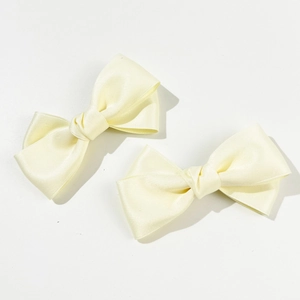 Elegant cream yellow satin bow hair clips set for women with smooth silk finish