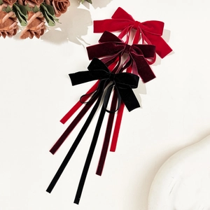 Three-piece set of velvet bow hair clips with long streamers in red, wine, and black colors