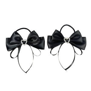 Pair of ballet-style black satin bow hair ties with silver rhinestone heart accents