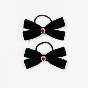 Detail of black velvet hair bows with ruby square gems and crystal accents