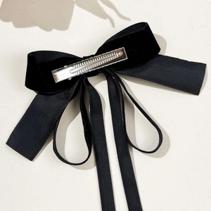 Elegant black velvet bow hair clip with ribbed ribbon and silver metal duckbill clip