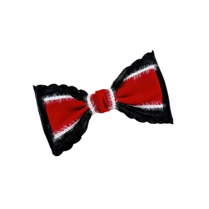 Elegant red velvet bow hair clip with white faux fur trim and black ribbon accents