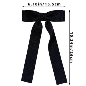 Detail showing dimensions of the black fabric bow hair clip with 15.5cm width and 26cm height
