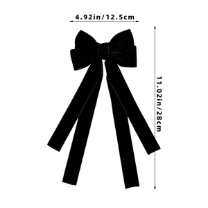 Detail showing the dimensions 12.5cm by 28cm of this large black velvet bow hair clip