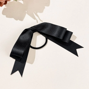 Close-up of black satin multi-layer bow hair tie with high-elasticity rubber band
