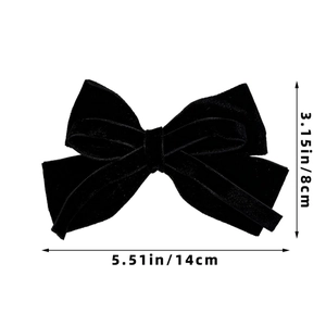 Detail shot of the black velvet bow hair clip showing dimensions 14cm by 8cm